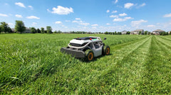 Mowrator S1 remote control lawn mower cutting a large residential lawn with clean mowing stripes